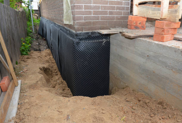 SJ Waterproofing Pros technician performing targeted Vapor Barrier Installation assessment in Holt, MI